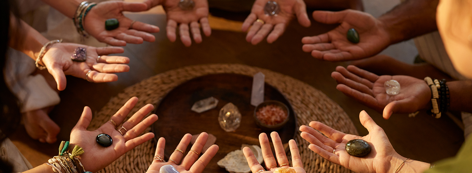 circle of hands each holding a special stone circle of hands each holding a special stone