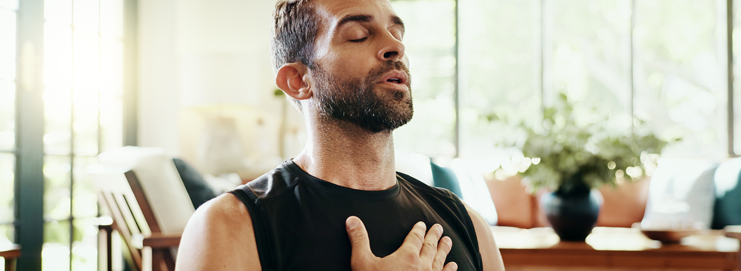 man breathing practice Man doing breathing practice